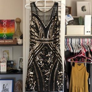 Black and gold sequin dress